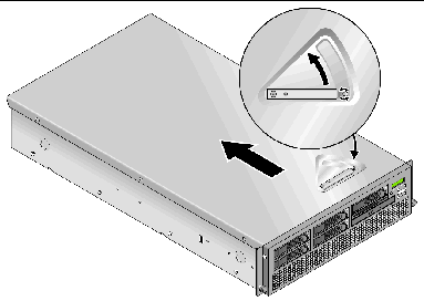 This graphic shows the location of the latch release on the cover of the Sun Fire V40z server and direction to slide the cover to remove it. 