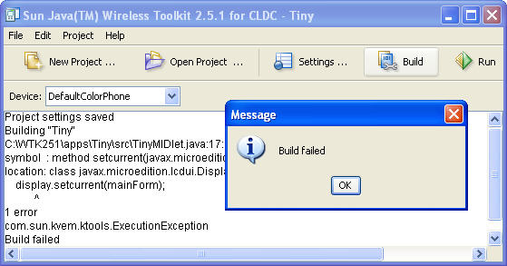 Console displays build messages for Tiny file with error. The caret ^ indicates the error.