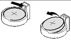 Figure showing how to push the upper end of the metal retainer away from the battery so that you can remove it.