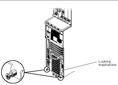 Figure showing two screws to loosen at the bottom of a Netra CT 410 server and location of the power supply unit locking mechanism.