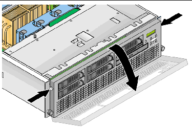 Graphic showing how to open the front bezel on the Sun Fire V40z server by pressing in on the release buttons on each side.