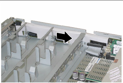 Pushing the front I/O board toward the chassis rear to disengage it from the chassis tabs.