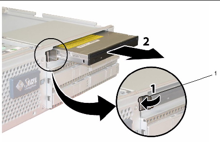 Removing the DVD-ROM drive after pushing the front securing latch to the left.