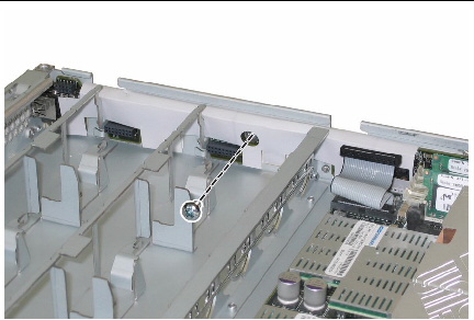 Removing the single screw that secures the front I/O board. 