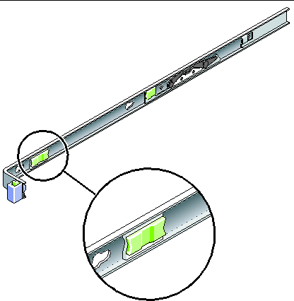 Image shows the slide rail release button near the from of the mounting bracket