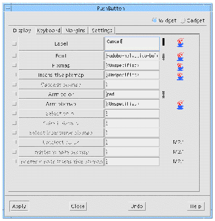 The Display page of the PushButton resource panel showing change bars for the explicitly set Label, Font and Arm color resources.
