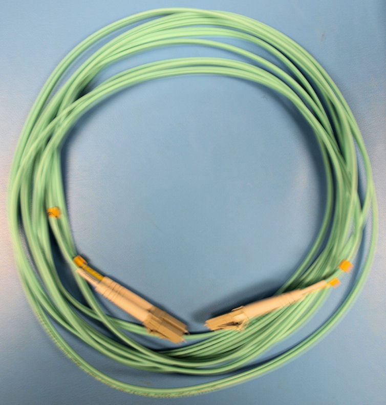 This picture shows a 10 Gigabit fiber optic cable (aqua .50/125).