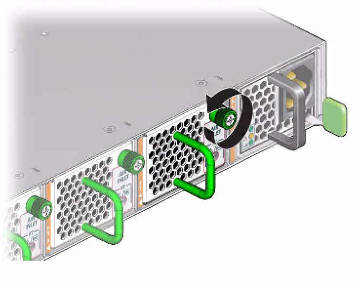 image:Figure shows the green captive screw that releases the fan module.