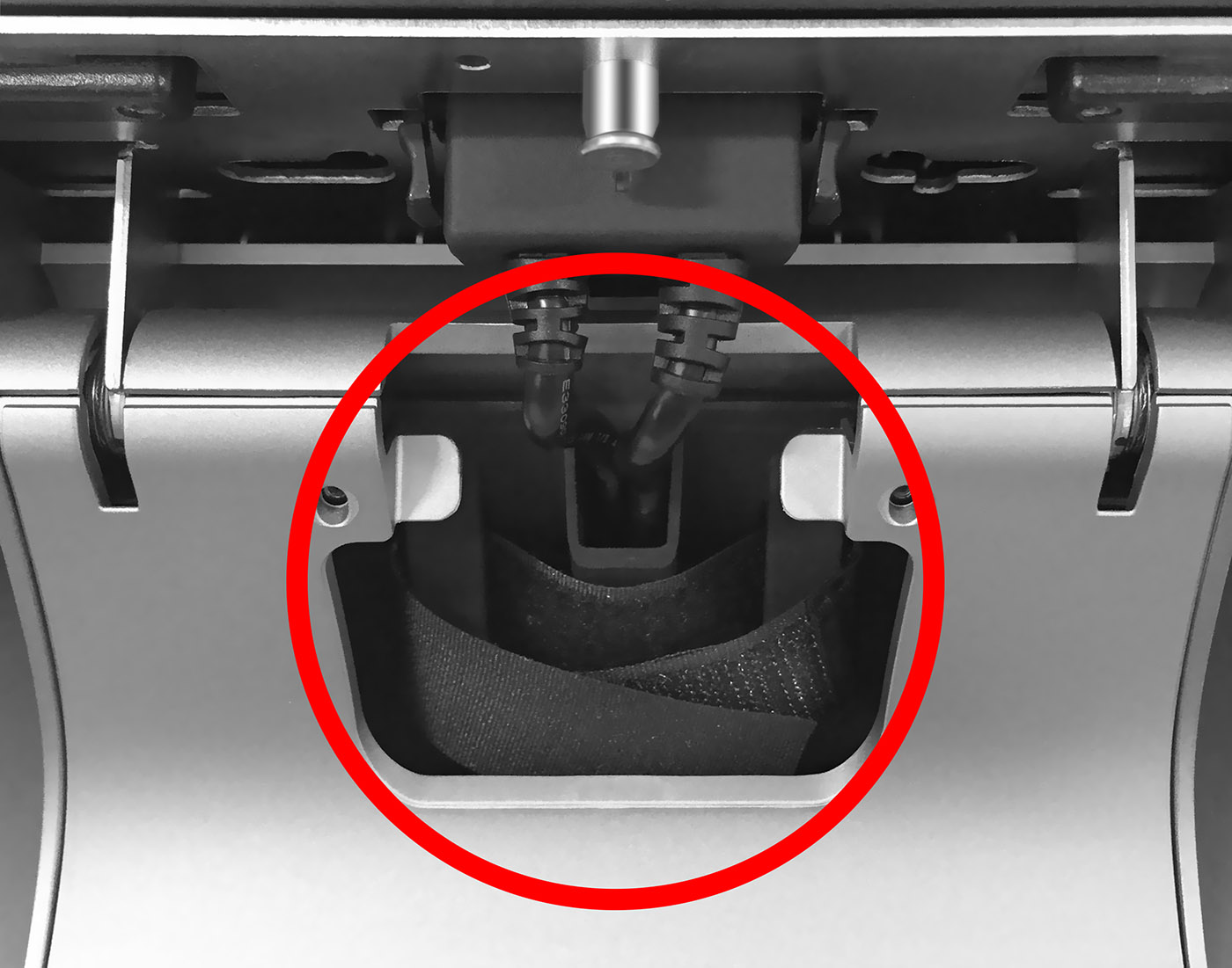 This figure shows the location of the Velcro straps in the Adjustable Stand.