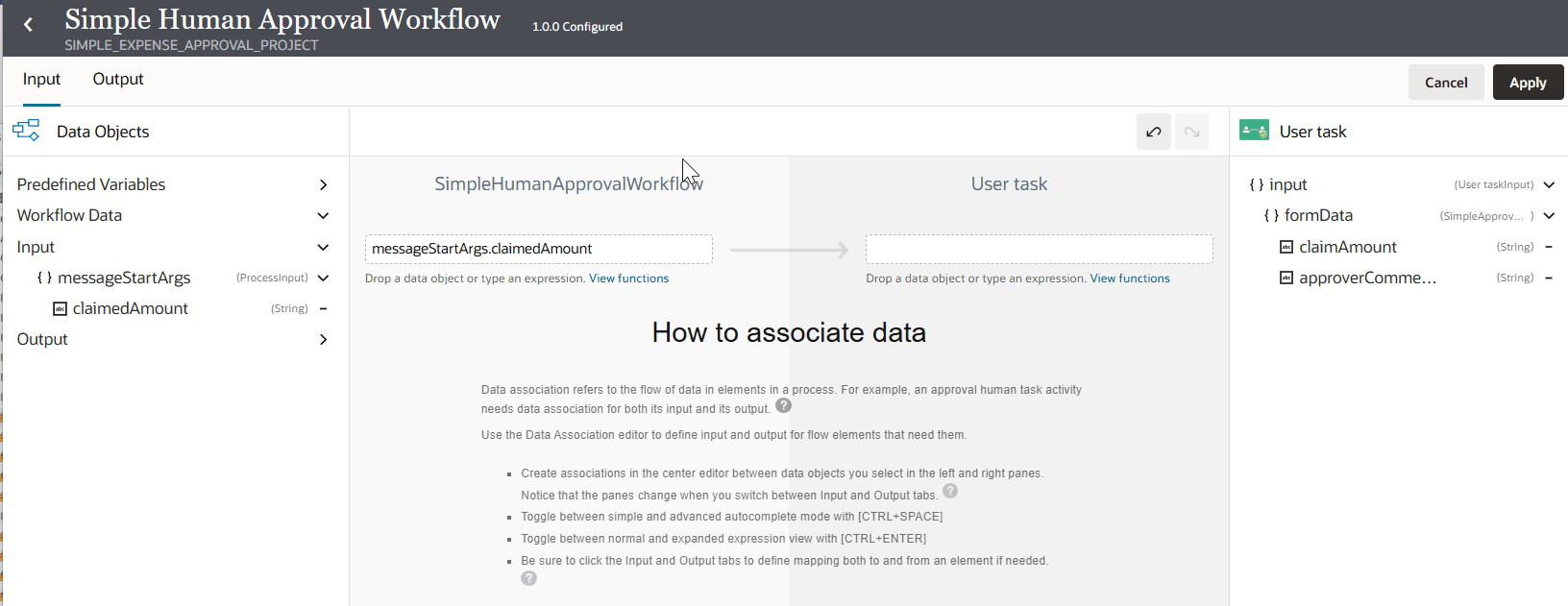 ユーザー・タスクの入力マッピング・ビュー。 左側の「データ・オブジェクト」パネルには、入力変数messageStartArgsとその文字列プロパティclaimedAmountを含む、事前定義済の変数およびワークフロー・データが表示されます。 中央の領域にはマッピング・エディタが表示され、ワークフローの「messageStartArgs.claimedAmount」をユーザー・タスクのフィールドにマップする準備ができていますが、まだ関連付けられていません。 右側のパネルには、フォーム・データ・フィールド「claimAmount」および「approverComments」を含むユーザー・タスク入力構造が表示されます。 上部には、「入力/出力」タブと「適用/取消」ボタンがあります。 