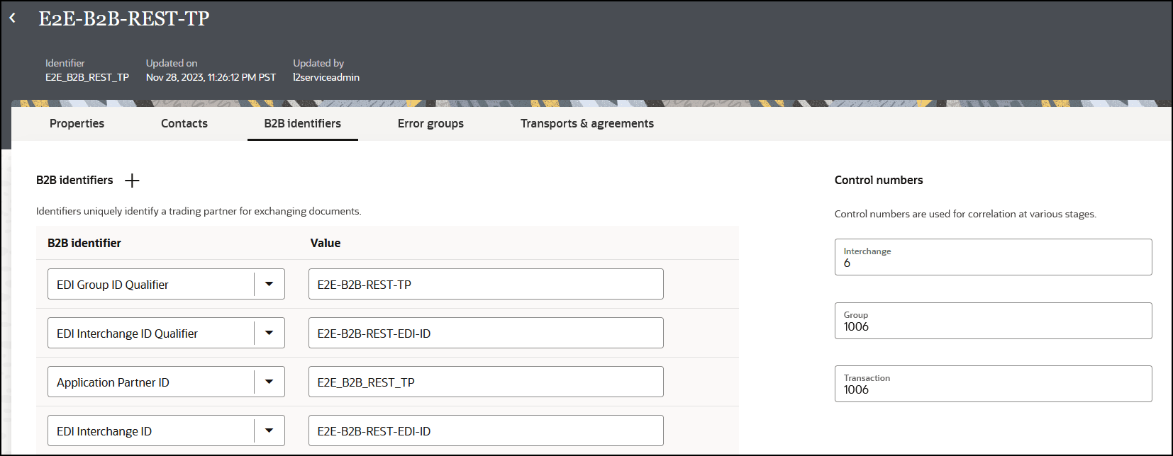 「プロパティ」、「連絡先」、「B2B識別子」(選択されている)および「トランスポートとアグリーメント」タブが上部に表示されます。 下にはB2B識別子のタイトルとプラス(追加)アイコンがあり、B2B識別子と値の列を含む表があります。 右側にはコントロール番号セクションがあり、交換、グループおよびトランザクションのフィールドがあります。 「プロパティ」、「連絡先」、「B2B識別子」(選択されている)および「トランスポートとアグリーメント」タブが上部に表示されます。 下にはB2B識別子のタイトルとプラス(追加)アイコンがあり、B2B識別子と値の列を含む表があります。 右側にはコントロール番号セクションがあり、交換、グループおよびトランザクションのフィールドがあります。