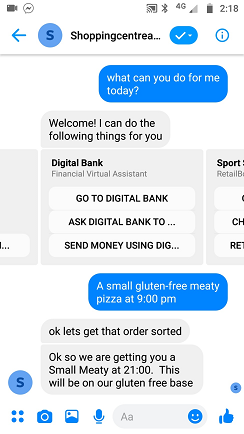 Screenshot of Facebook Messenger on a mobile device. 'Shoppingcentrea...' is shown on the top of the screen. Below that is a chat beginning with 'what can you do for me today?'. The first response is 'Welcome, I can do the following things for you', followed by a carousel which shows options for Digital Bank and other skills that are not fully visible. And that is followed by a few more exchanges.