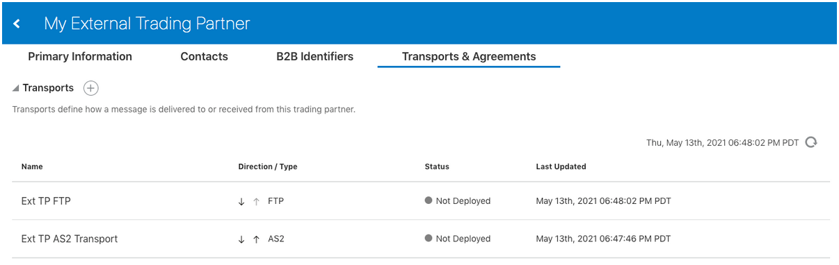 Tabs for Primary Information, Contacts, B2B Identifiers, and Transports & Agreements appear at the top. Below is the Transports section. A + sign appears to the right. Below this is a table with columns for Name, Direction/Type, Status, and Last Updated. Above this last column and to the right is a refresh button.