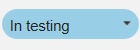 "In testing" status dropdown field value on blue color background.