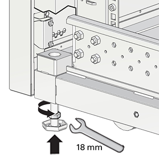 This figure shows the leveling feet being locked in place with an open wrench.