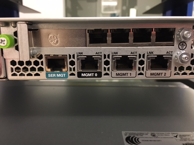 This image shows an example of the rear console of either an Acme Packet 3900, 4600, or 6300, with the MGMT1 port labeled.