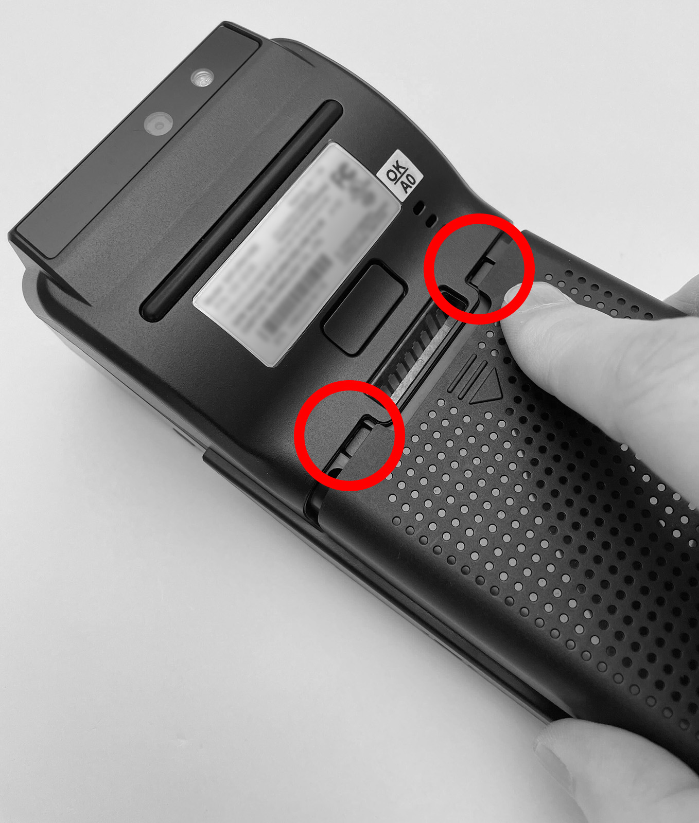 This figure shows how to slide the battery cover into place on the Castles S1F2 Mobile Order and Payment Terminal.