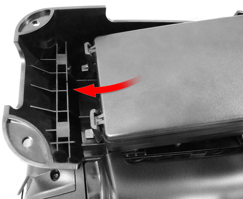 This image depicts sliding the battery enclosure into the slots on the bottom of the Basic Stand