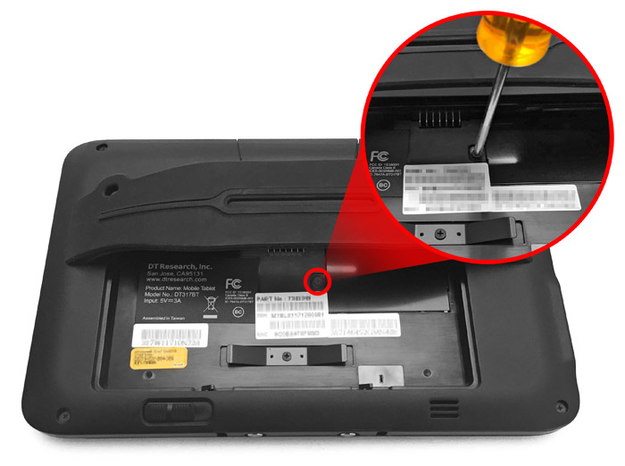This figure depicts removing the bridge battery cover with a screwdriver.