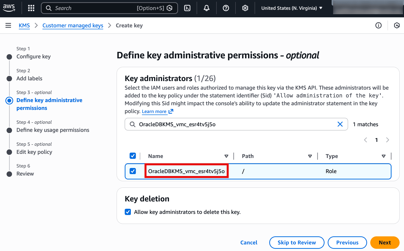 This screenshot is from the AWS KMS Create key wizard at Step 3 (optional): Define key administrative permissions. It shows the Key administrators list, where the IAM role OracleDBKMS_vmc_esr4tv5j5o is selected to administer the key. The checkbox under Key deletion is enabled, allowing key administrators to delete the key. The Next button will continue to defining key usage permissions and the key policy.