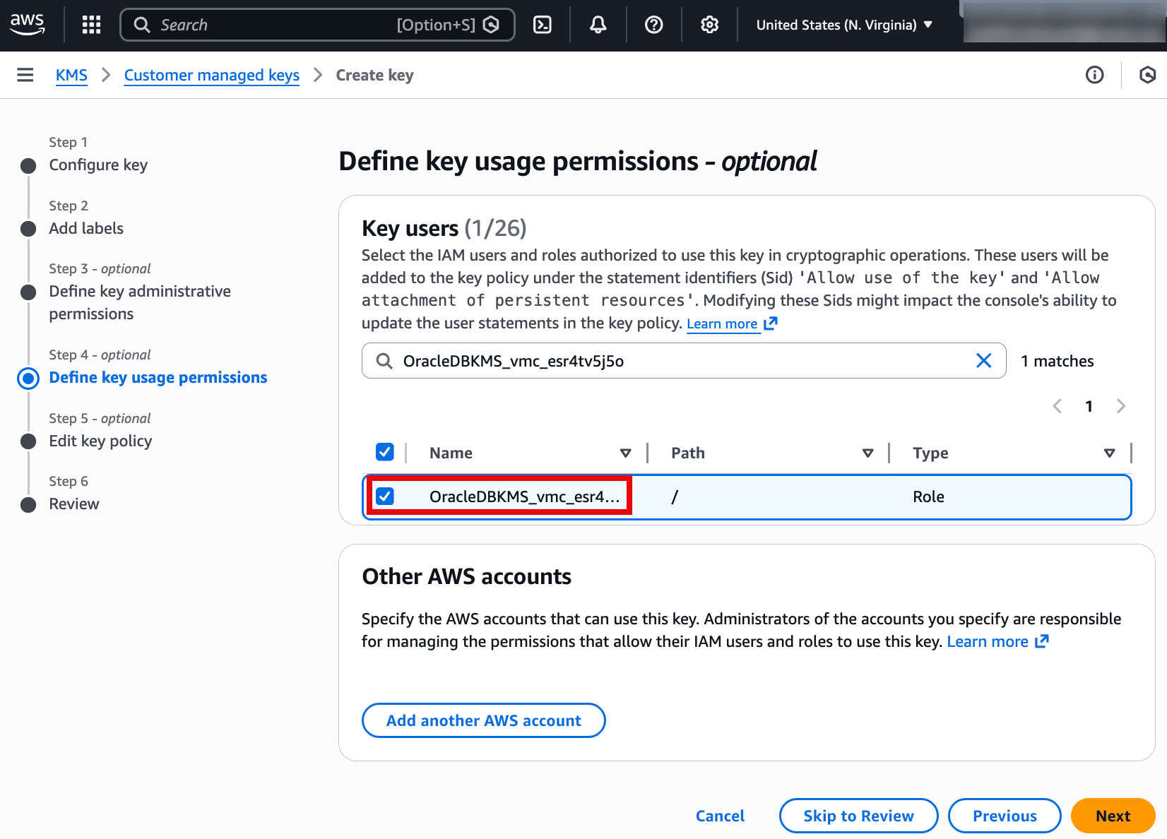 This screenshot is from the AWS KMS Create key wizard at Step 4 (optional): Define key usage permissions. It shows the Key users section where the IAM role OracleDBKMS_vmc_esr4tv5j5o is selected, meaning this role is allowed to use the key for cryptographic operations (such as encrypt/decrypt). There’s also an Other AWS accounts section to optionally grant key usage to additional accounts. The Next button proceeds to editing the key policy and final review.