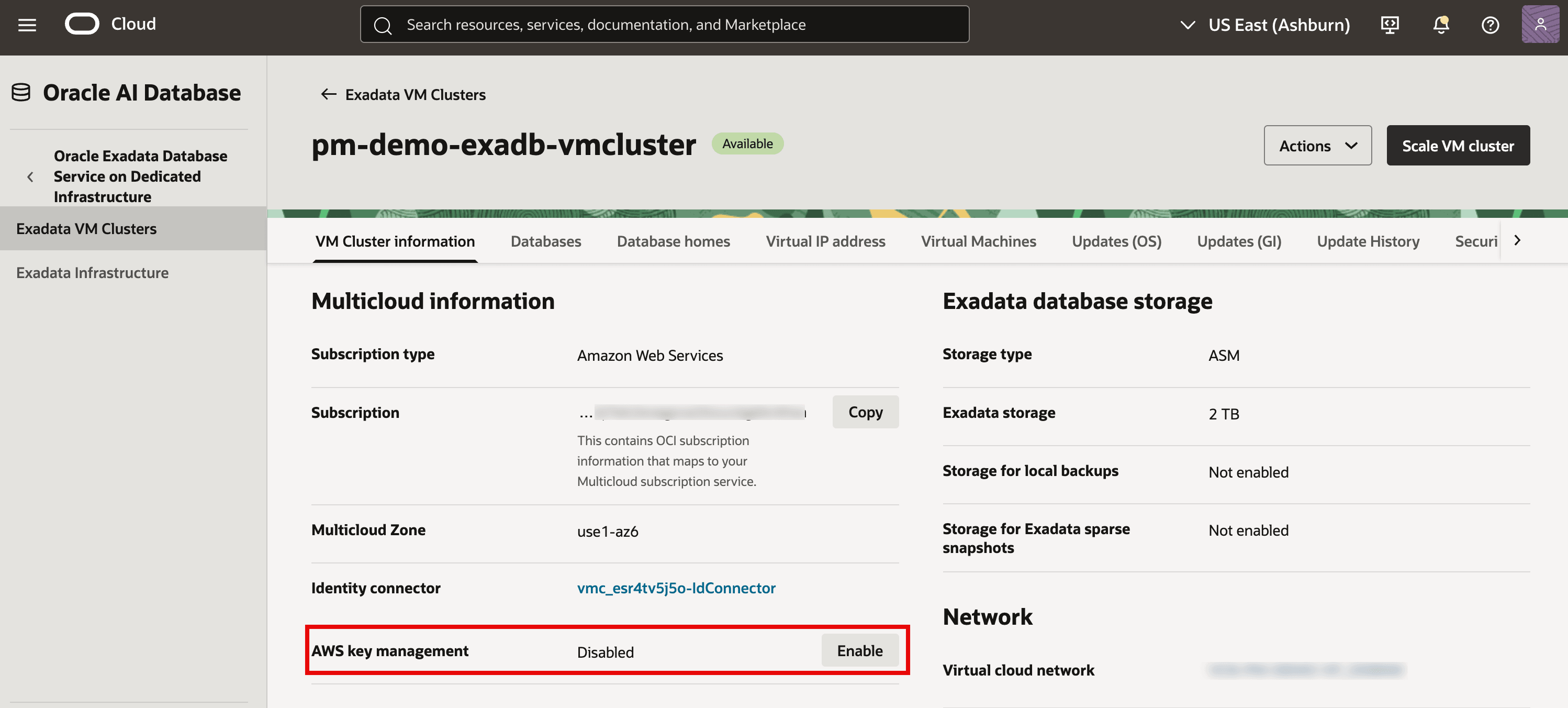 The image shows the OCI console page for an Exadata VM cluster (“pm-demo-exadb-vmcluster”) with the Multicloud information section visible. The highlighted row indicates AWS key management is currently Disabled, and there’s an Enable button to turn it on. It also lists the subscription type as Amazon Web Services and shows the associated identity connector used for AWS integration. Enabling AWS key management is a prerequisite for using AWS KMS customer-managed keys for features like TDE encryption.